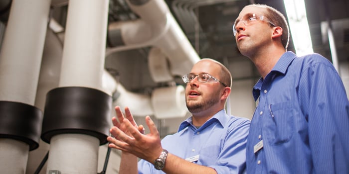 two field engineers evaluating downstream applications